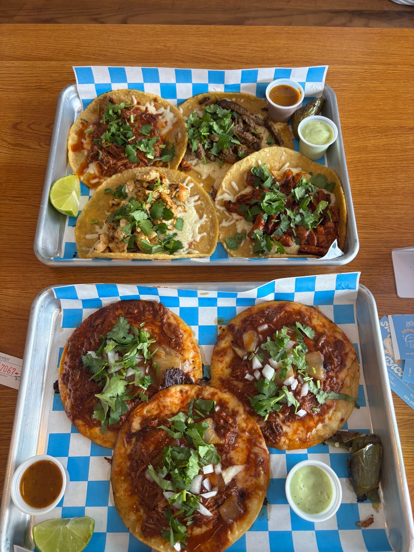 Taco trays with birria, carne asada, al pastor, and chicken at Sison Tacos